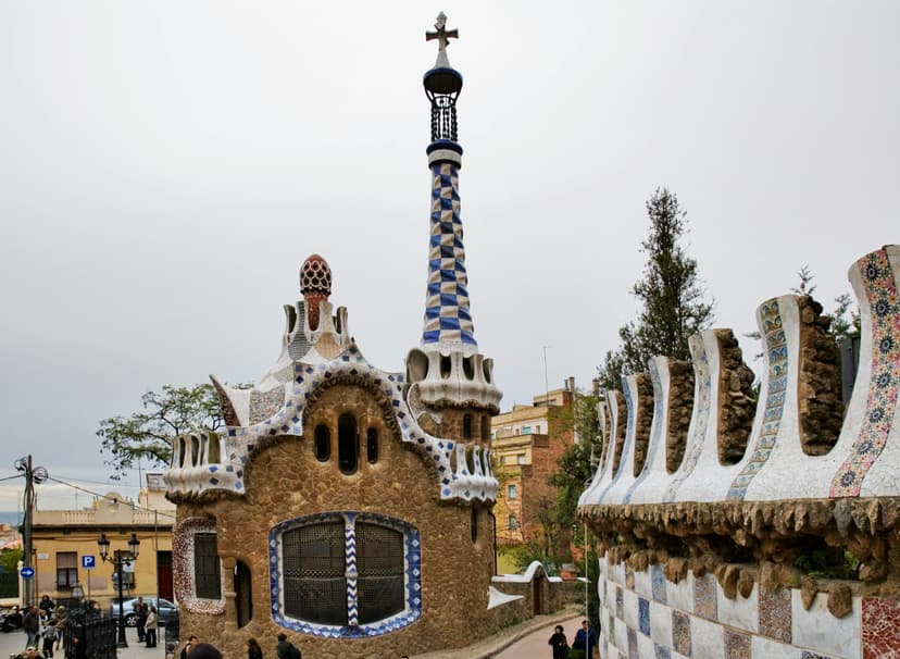 The iconic, skeletal facade of Casa Batlló at twilight, with its colorful mosaic and mask-like balconies.